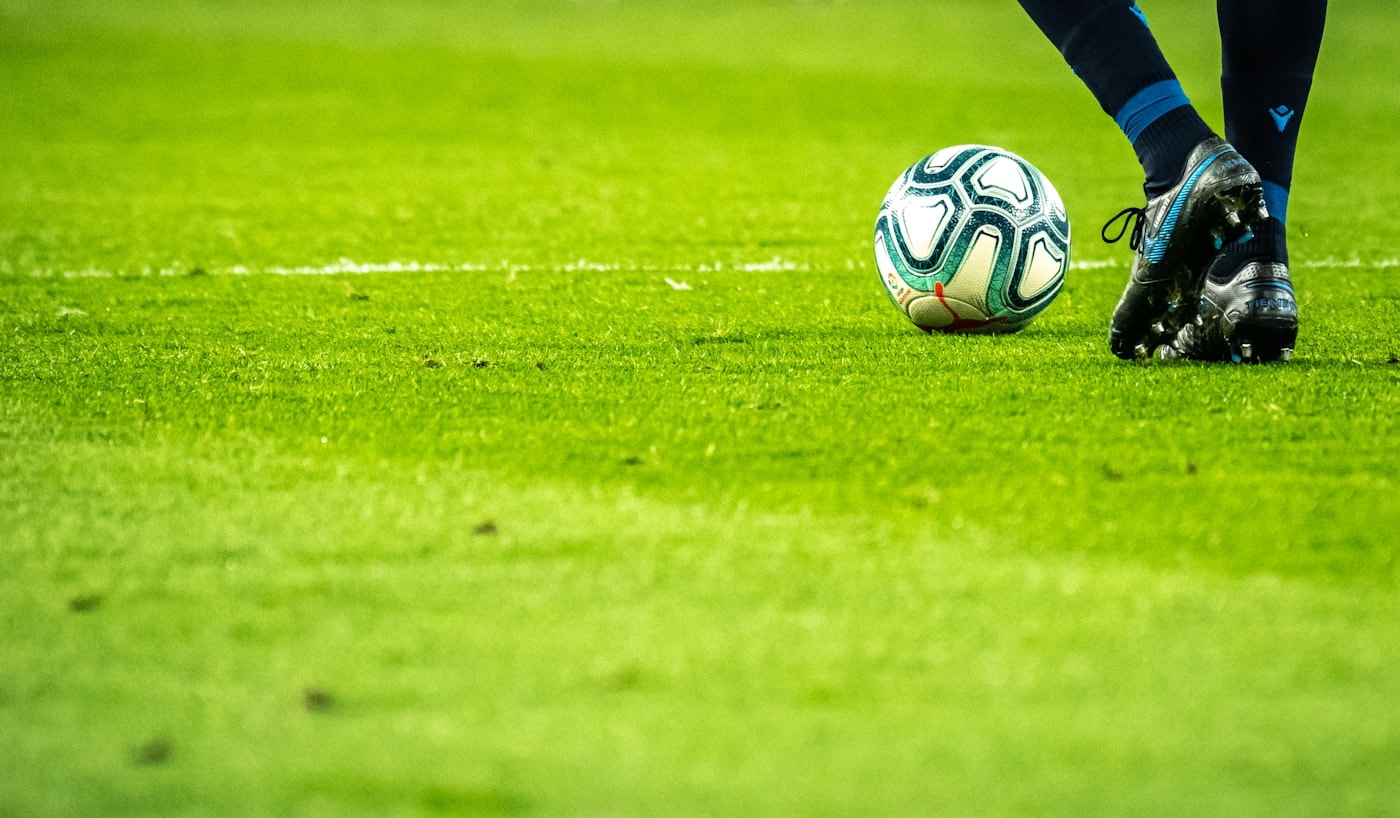 Soccer ball on dense green turf
